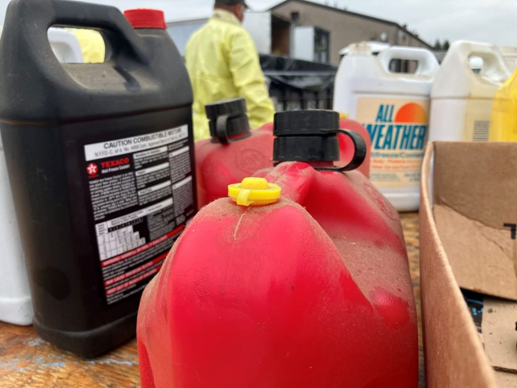 Various jugs of hazardous waste