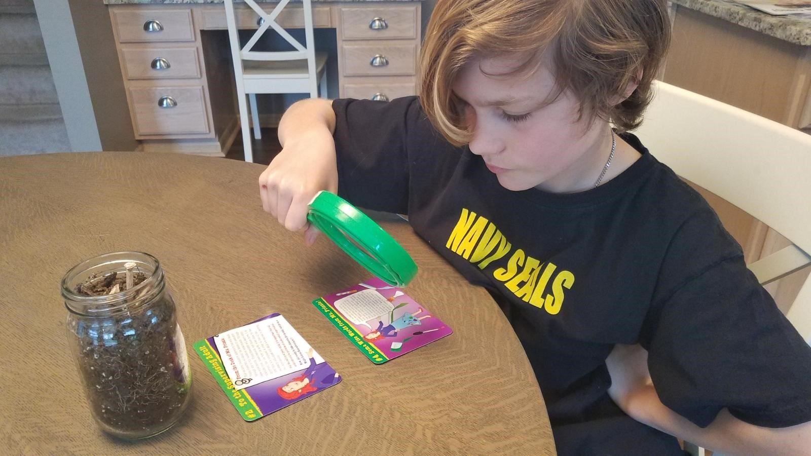 Student with Magnifying Glass
