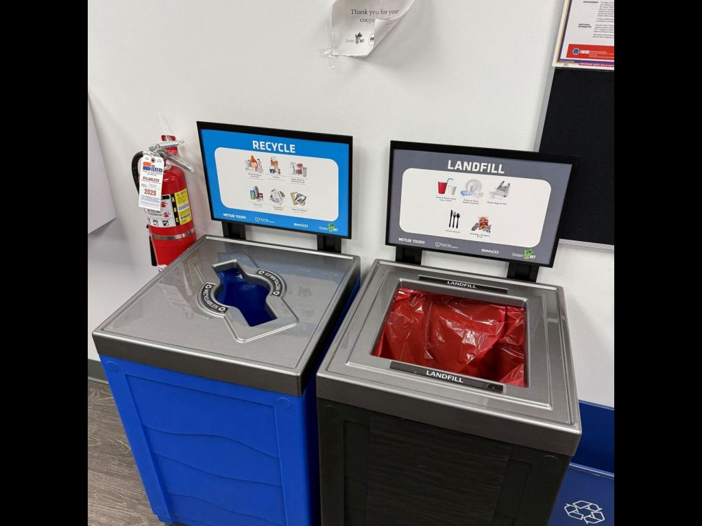 A recycling bin and a landfill bin.