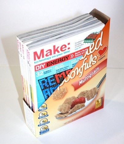 A magazine holder made from a cereal box.