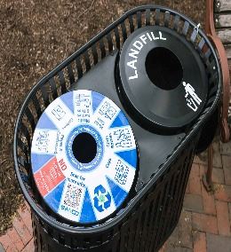 A bin separated into recycling and landfill