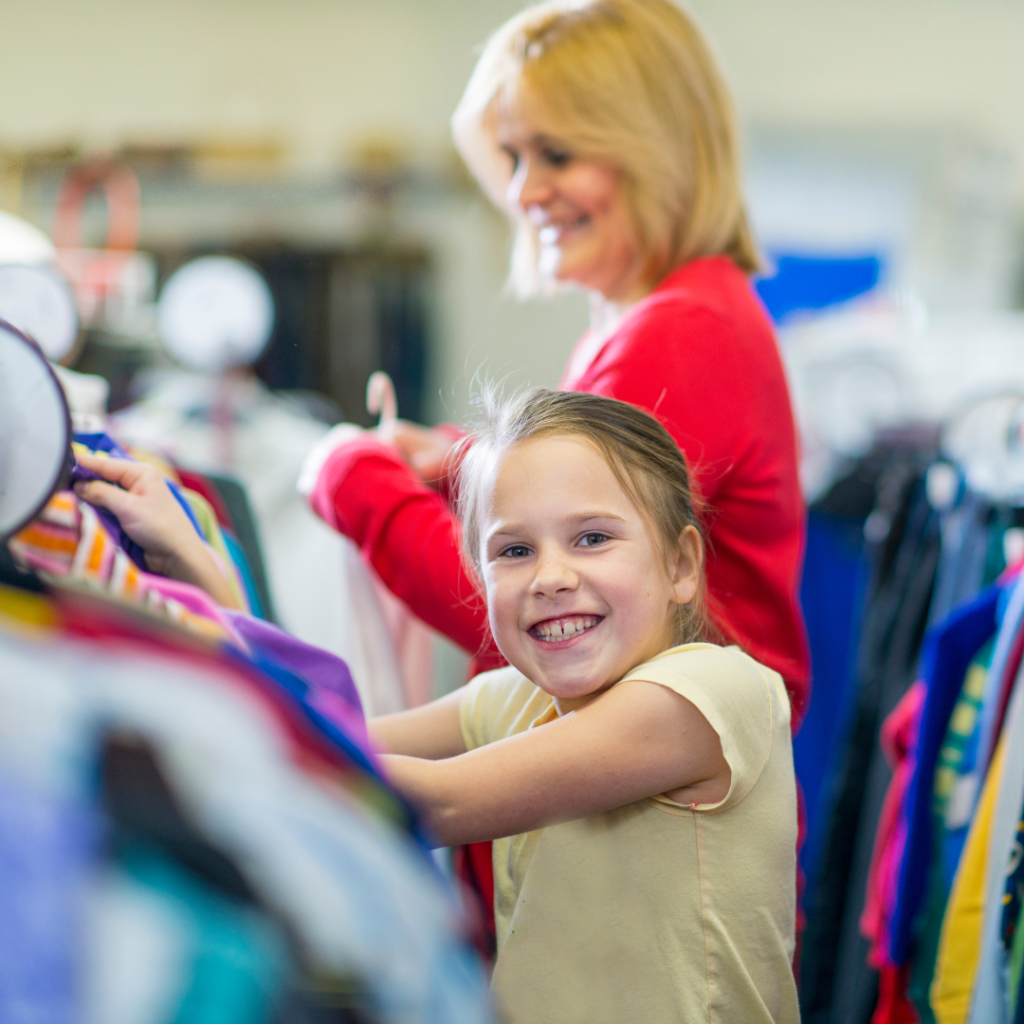 A mother and a daughter shopping for clothes.